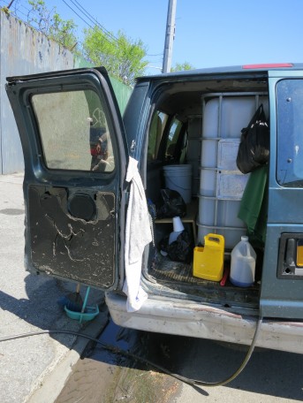 Almonte’s van has been customized for car washing. Inside is a 250-gallon water tank that connects to his pressure washer, which is powered by a portable generator.